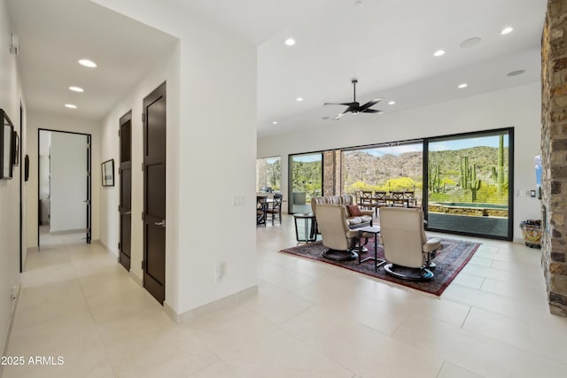 living area with recessed lighting, ceiling fan, and light tile patterned flooring