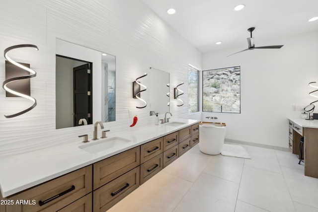 bathroom featuring double vanity, a sink, and ceiling fan