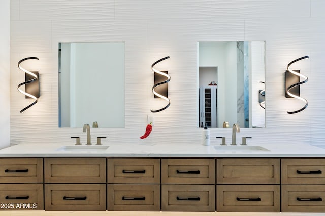 bathroom featuring a sink and double vanity