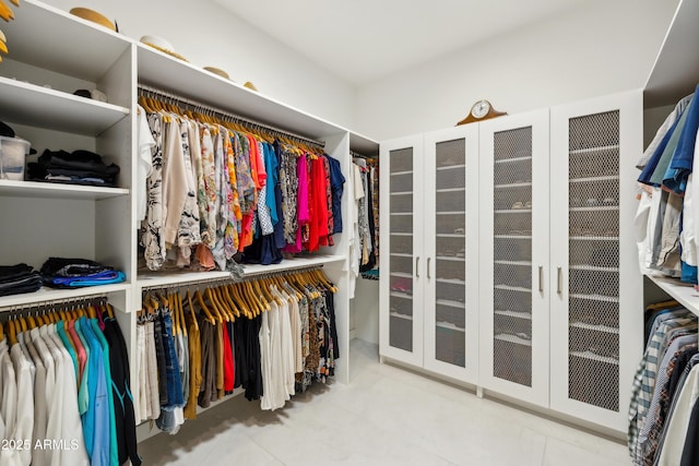 spacious closet featuring tile patterned floors