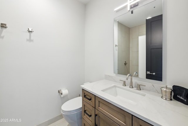 bathroom featuring toilet and vanity
