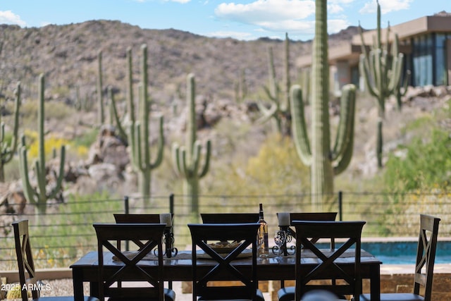dining room featuring a mountain view