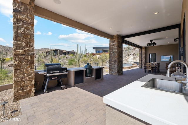 view of patio featuring a sink and area for grilling