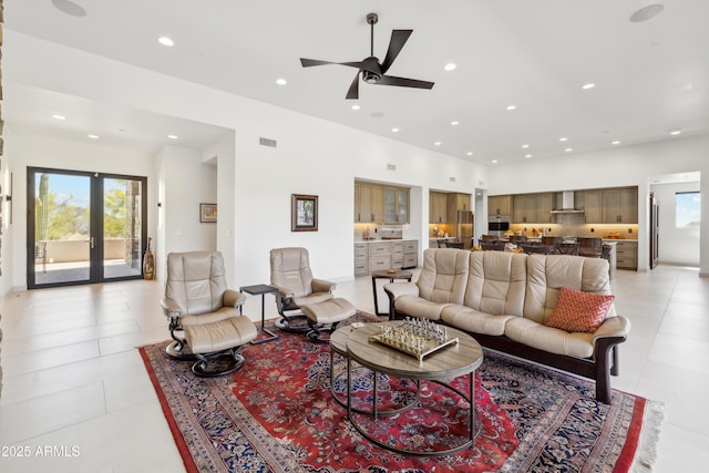 living area featuring recessed lighting, ceiling fan, visible vents, and light tile patterned floors