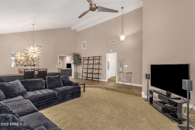 living area featuring beam ceiling, carpet flooring, visible vents, and ceiling fan with notable chandelier