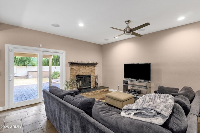 living area with a fireplace, baseboards, a ceiling fan, and recessed lighting