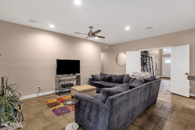 living room with ceiling fan, recessed lighting, and baseboards