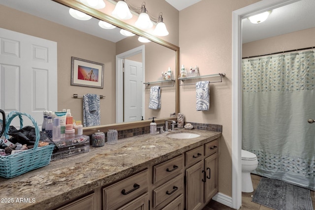 full bath with toilet, tile patterned flooring, vanity, and a shower with curtain