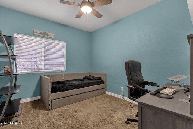 carpeted bedroom with a ceiling fan and baseboards