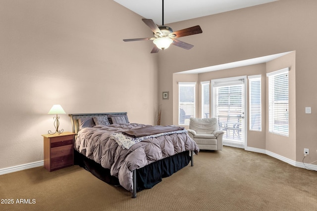 bedroom with a ceiling fan, carpet flooring, and baseboards