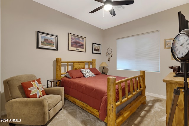 bedroom featuring ceiling fan and carpet