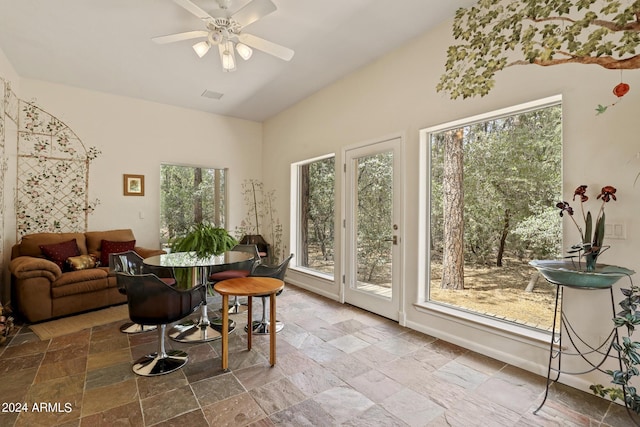 dining space featuring vaulted ceiling and ceiling fan