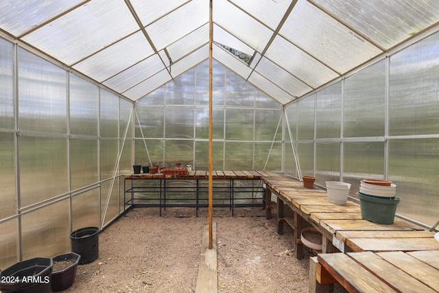 sunroom featuring vaulted ceiling