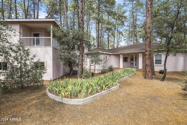 view of front of property with a balcony