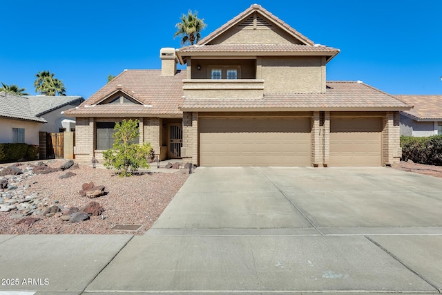 view of front of home featuring a chimney, stucco siding, concrete driveway, stone siding, and a tiled roof