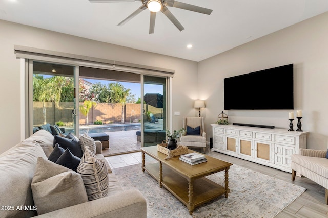 living room with recessed lighting, a ceiling fan, and a healthy amount of sunlight