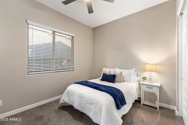 bedroom with a ceiling fan, baseboards, and carpet