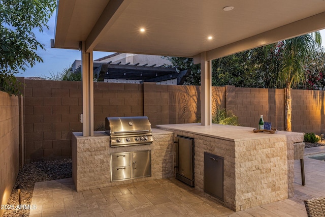 view of patio featuring a fenced backyard and area for grilling
