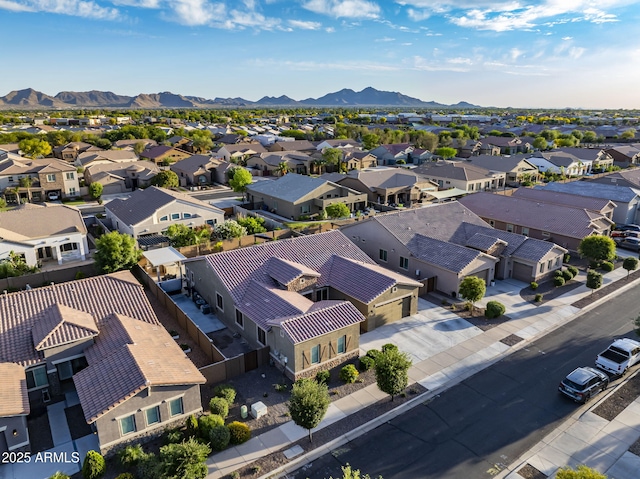 drone / aerial view with a mountain view and a residential view