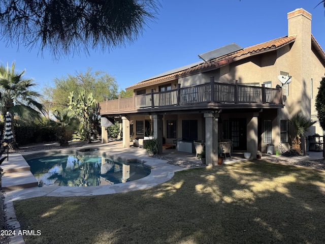 view of swimming pool with a wooden deck and a patio