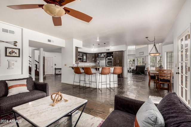 living room featuring ceiling fan