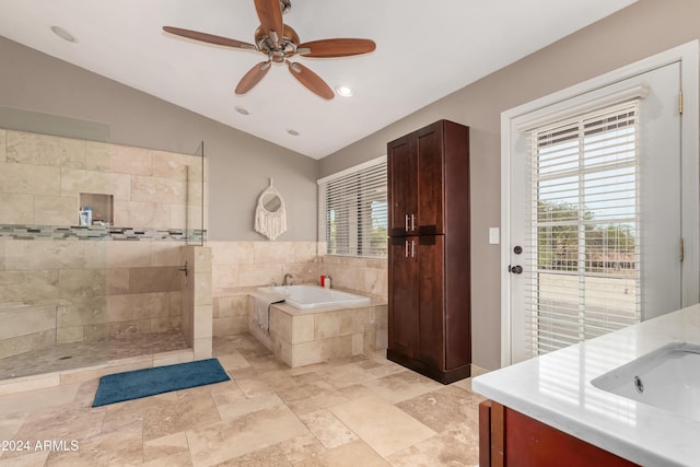 bathroom with vanity, separate shower and tub, ceiling fan, and lofted ceiling