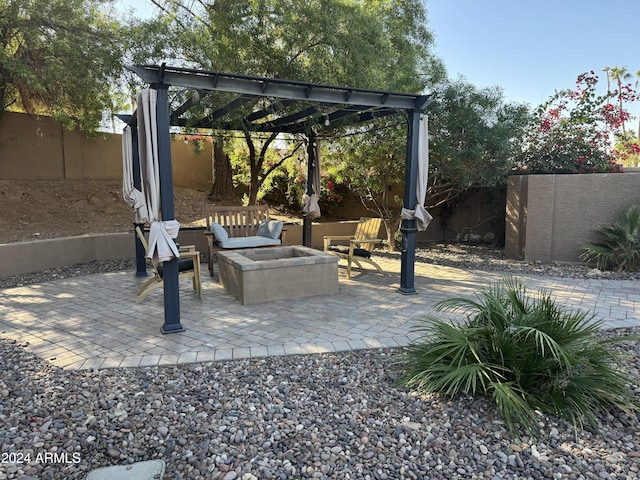 view of patio / terrace with a fire pit and a pergola