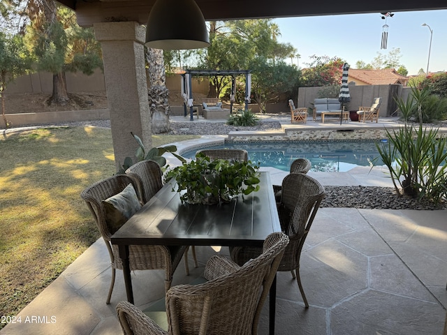 view of patio / terrace featuring a fenced in pool, a pergola, and an outdoor living space