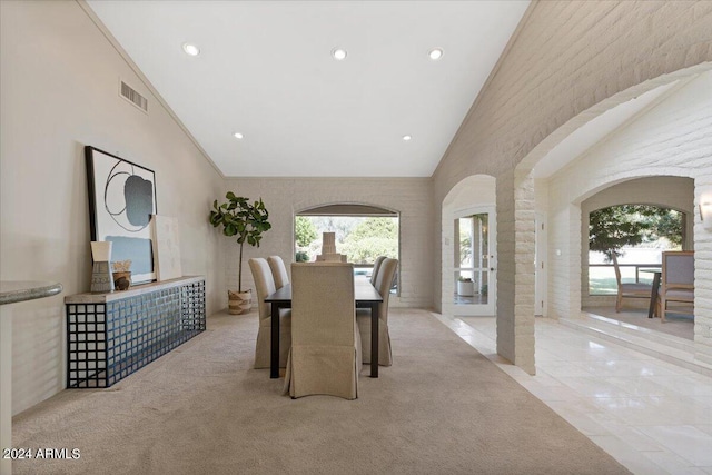 6516 E Maverick Rd, Paradise Valley, AZ 85253 - carpeted dining room featuring visible vents, high vaulted ceiling, arched walkways, and recessed lighting