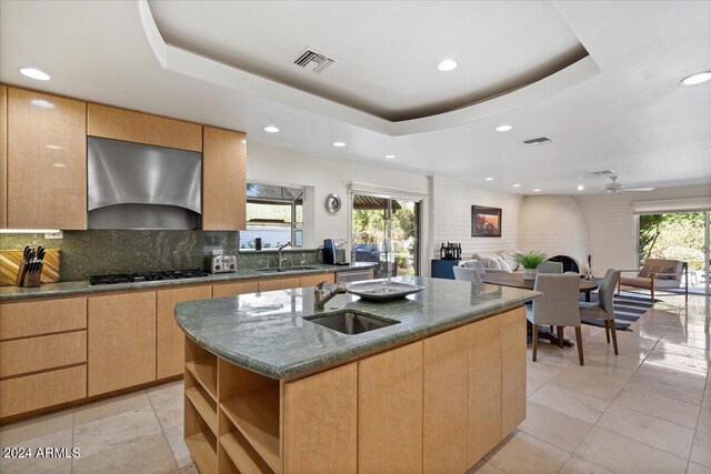 6516 E Maverick Rd, Paradise Valley, AZ 85253 - kitchen featuring visible vents, ventilation hood, a sink, and a raised ceiling