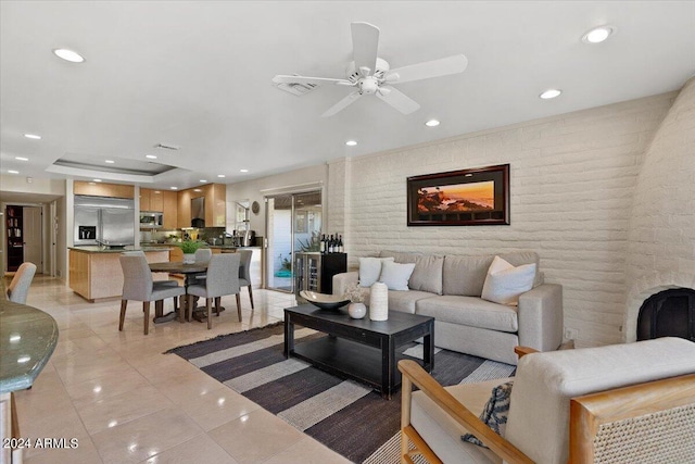 6516 E Maverick Rd, Paradise Valley, AZ 85253 - living area featuring visible vents, ceiling fan, recessed lighting, brick wall, and light tile patterned floors