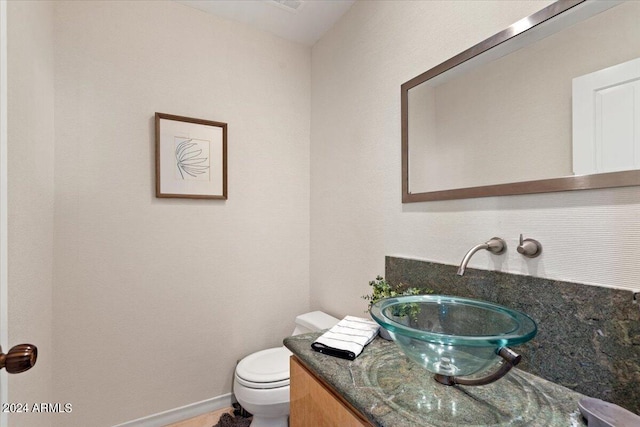 6516 E Maverick Rd, Paradise Valley, AZ 85253 - bathroom with toilet, vanity, and baseboards