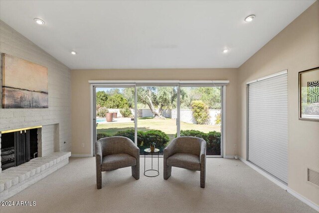 6516 E Maverick Rd, Paradise Valley, AZ 85253 - living area featuring light carpet, a brick fireplace, lofted ceiling, baseboards, and recessed lighting