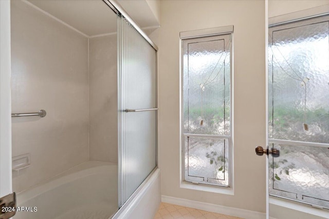 6516 E Maverick Rd, Paradise Valley, AZ 85253 - bathroom featuring baseboards and bath / shower combo with glass door