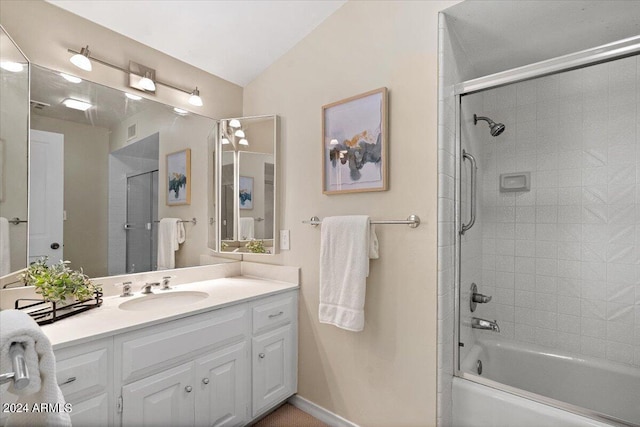 6516 E Maverick Rd, Paradise Valley, AZ 85253 - bathroom with visible vents, baseboards, vanity, shower / washtub combination, and vaulted ceiling