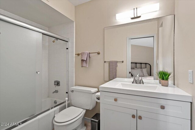 6516 E Maverick Rd, Paradise Valley, AZ 85253 - bathroom featuring toilet, vanity, and tub / shower combination