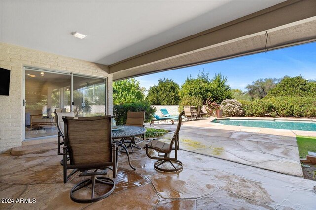 6516 E Maverick Rd, Paradise Valley, AZ 85253 - view of patio featuring a fenced in pool and outdoor dining space