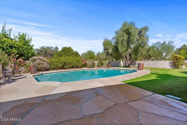 6516 E Maverick Rd, Paradise Valley, AZ 85253 - view of swimming pool featuring a fenced in pool, a lawn, fence, and a patio