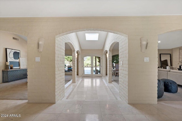 6516 E Maverick Rd, Paradise Valley, AZ 85253 - hall featuring french doors, tile patterned flooring, arched walkways, and visible vents