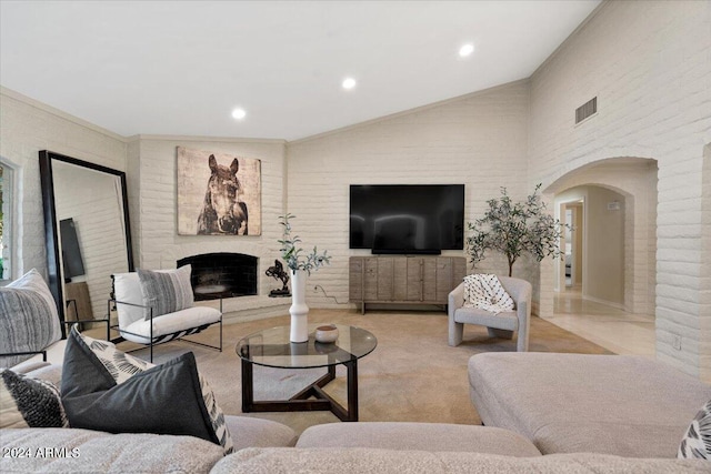 6516 E Maverick Rd, Paradise Valley, AZ 85253 - living area with vaulted ceiling, recessed lighting, a fireplace with raised hearth, arched walkways, and visible vents
