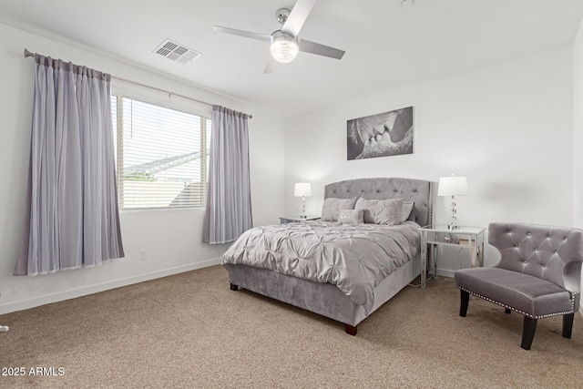 carpeted bedroom with baseboards, visible vents, and ceiling fan