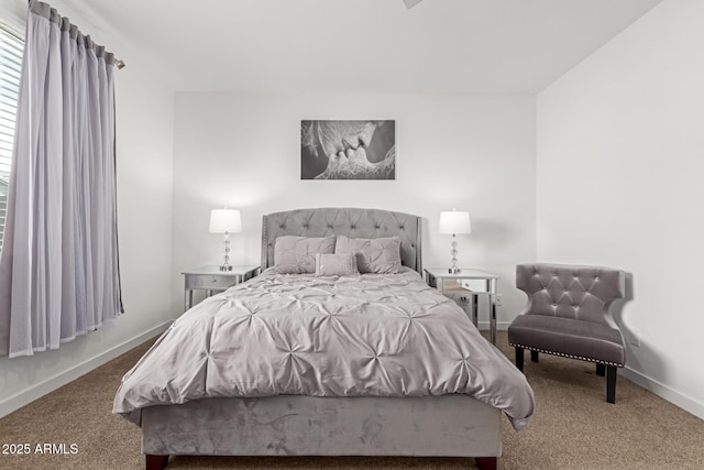 bedroom featuring baseboards and carpet