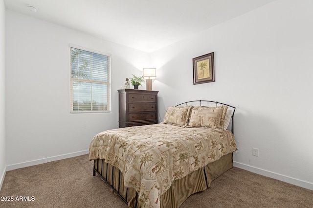 bedroom with baseboards and carpet floors