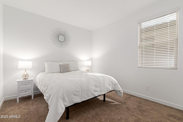 carpeted bedroom with baseboards