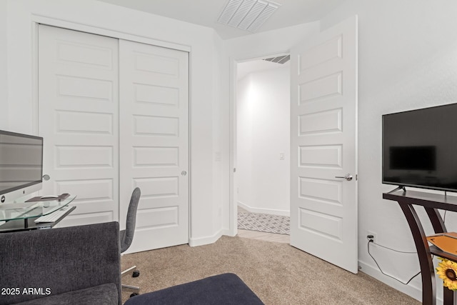 office featuring visible vents, baseboards, and carpet floors