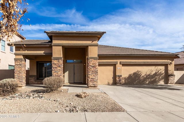 prairie-style house featuring a garage