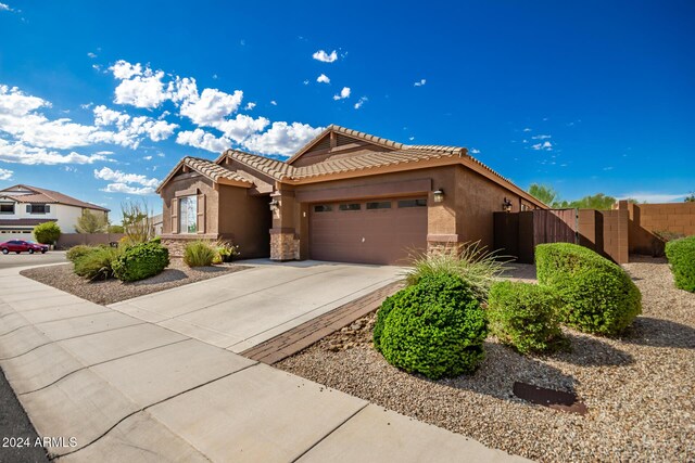 single story home with fence, driveway, stucco siding, a garage, and a tile roof