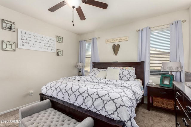 bedroom featuring ceiling fan and light carpet