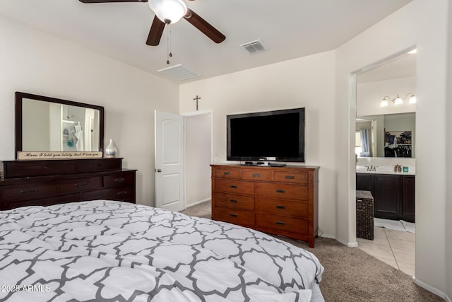 carpeted bedroom featuring ceiling fan and connected bathroom