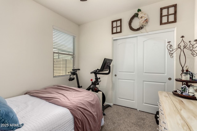 bedroom with light colored carpet and a closet